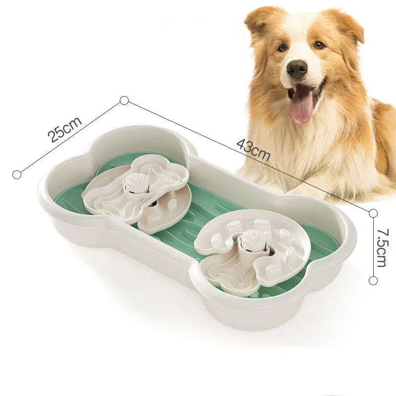 Large green slow feeder dog bowl with three rotating puzzle trays and non-slip suction cups on base