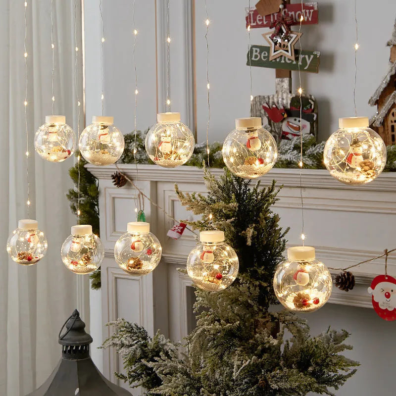 LED Christmas curtain light string with 10 decorative PVC lamp balls showing fairy, snowman, and wishing ball designs.