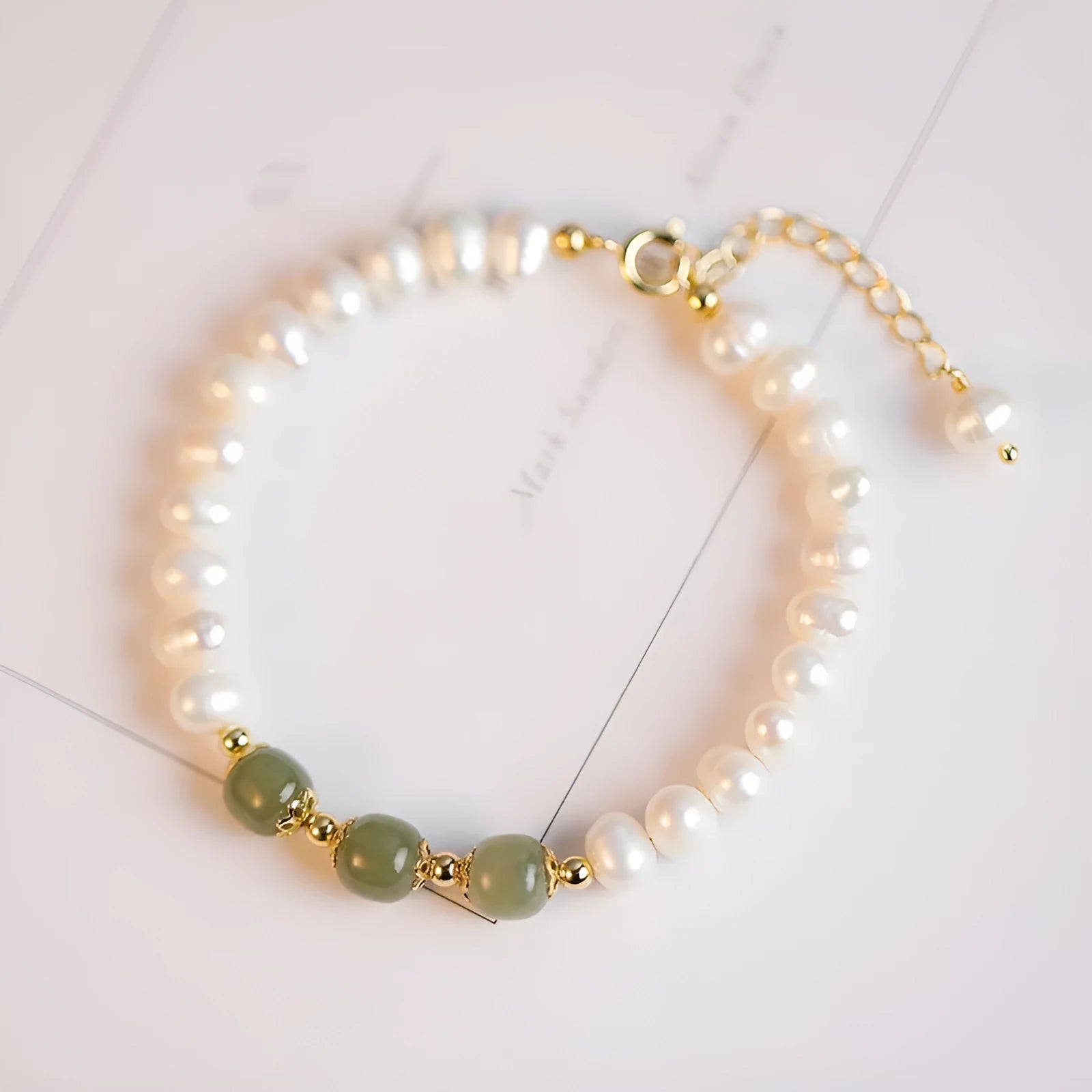 Korean style freshwater pearl bracelet with diamond-shaped electroplated pearls in Hetian jade colour.