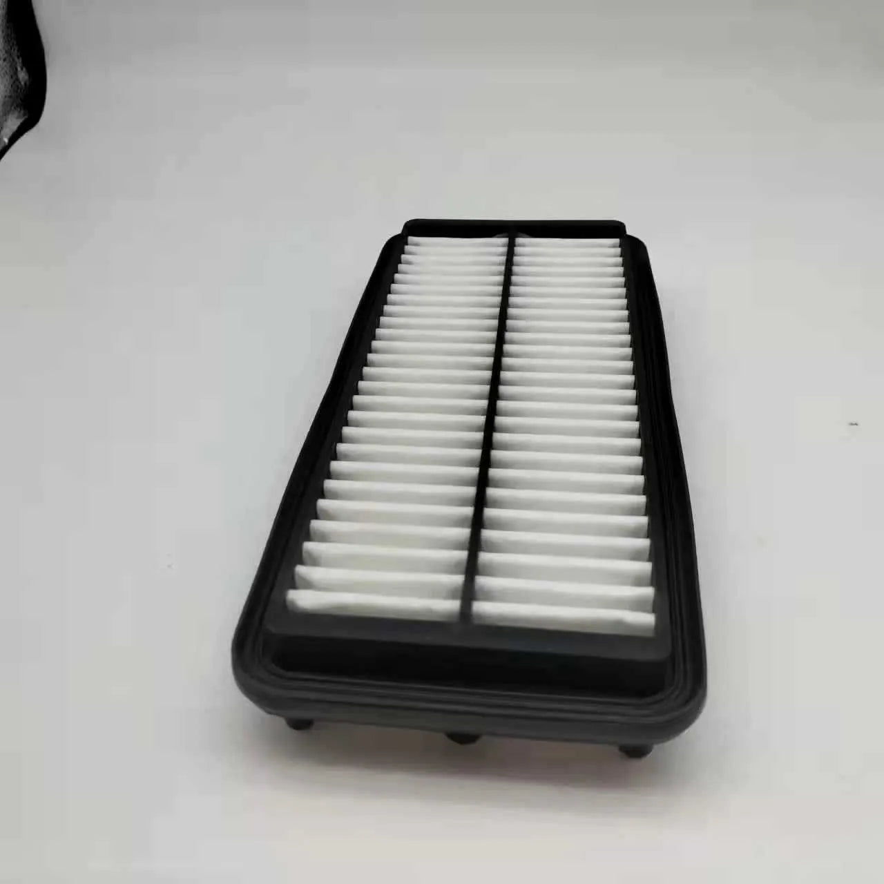 Black car air filter measuring 256x113x40mm for modern vehicle replacement