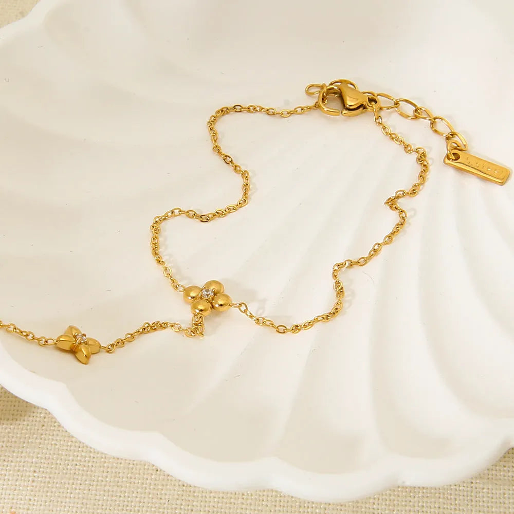 Gold stainless steel bracelet with eight-pointed stars and floral geometric design for women