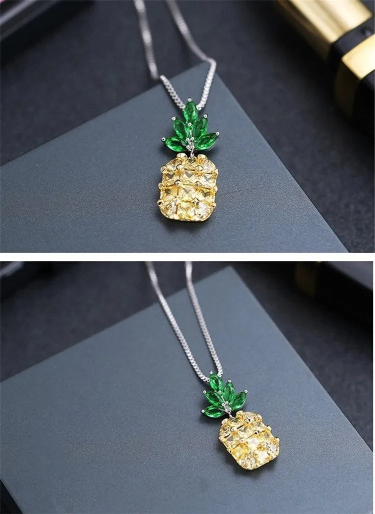 Silver pineapple charm necklace with geometric diamond design details