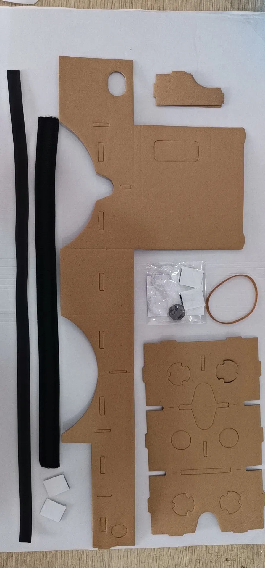 Pink and white flat-pack VR cardboard glasses viewer for 6-inch mobile phones.