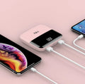 Portable 10000mAh power bank with digital display and dual USB outputs