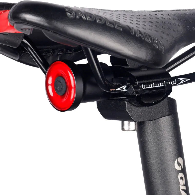ENFITNIX Xlite100 bicycle taillight with 6061 aluminium chassis, mounted on seat rail, black body with red lens