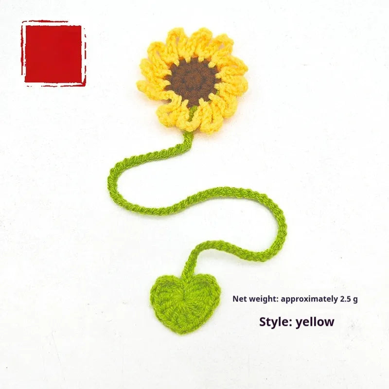 Hand-crocheted daisy flexible wire bookmark in yellow, pink, light purple, and orange colours.