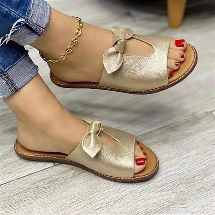 Ladies casual sandals with bow detail and fish mouth style in black, pink or gold