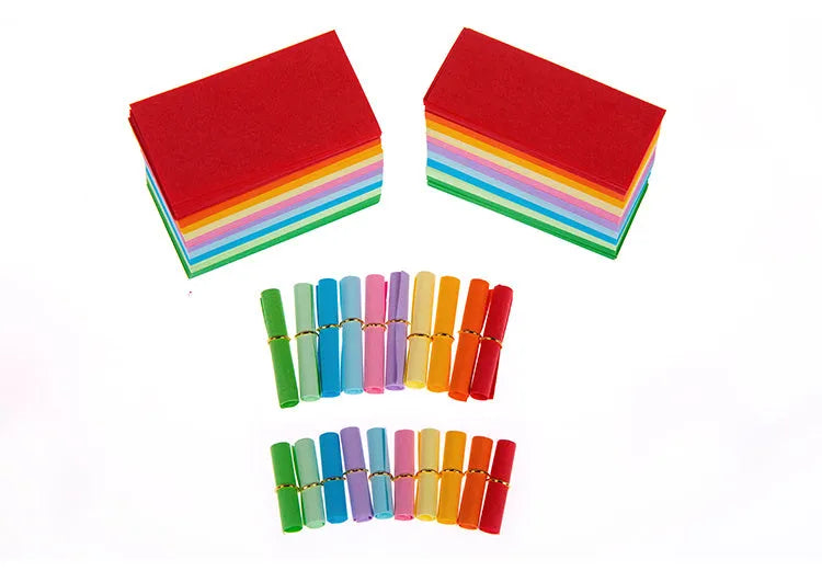 Assorted colourful scroll-style paper notes with metal eyelets in four different sizes.