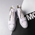 Men's black and white high-top style winter ankle boots made from PU leather and microfiber.