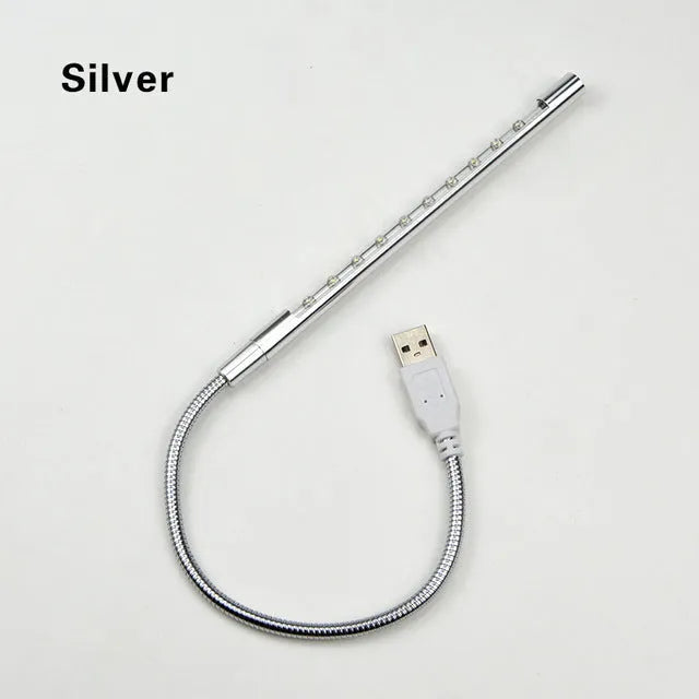Spiral-shaped USB LED night light in metallic finish with aluminium alloy shade and metal base.