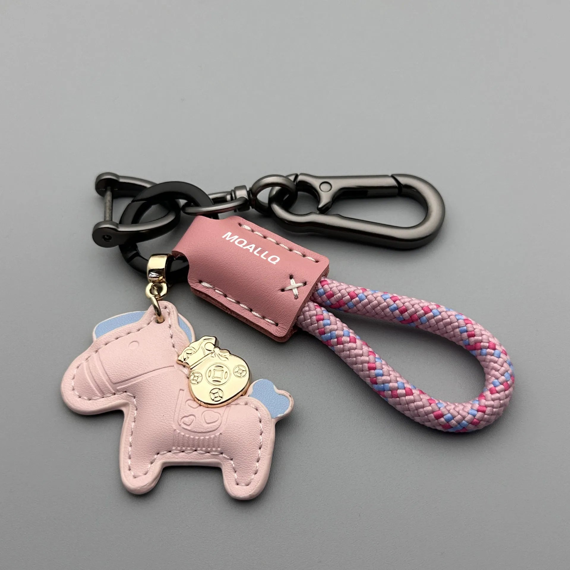Handmade brown cowhide car key pendant with green flanelle rope and a metal buckle.