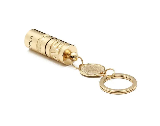 Gold zinc alloy waterproof mini LED flashlight attached to a keychain ring.