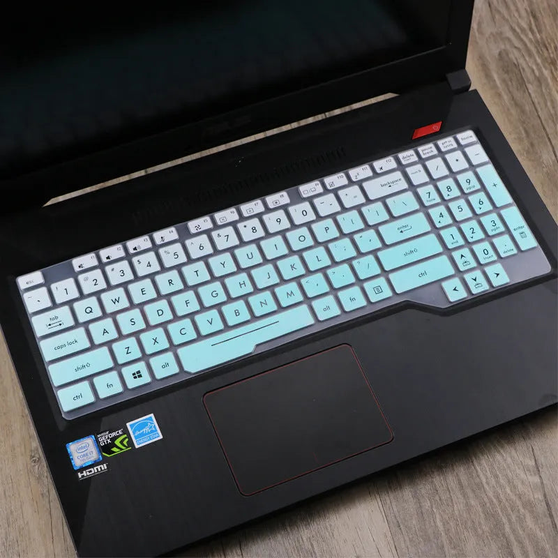 ASUS Flight laptop keyboard protective film cover shown in gradient blue on a laptop