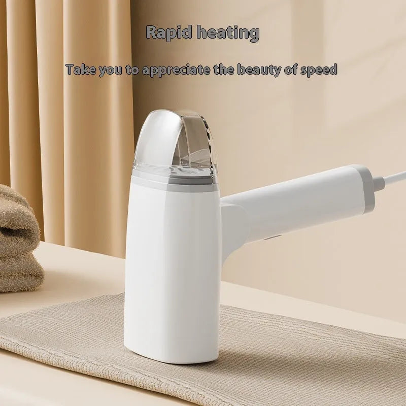 Blue handheld garment steamer with mechanical controls and hanging function