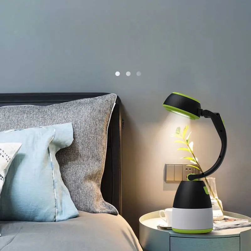 Black green multifunctional LED lamp in folded position showing USB charging port and adjustable head