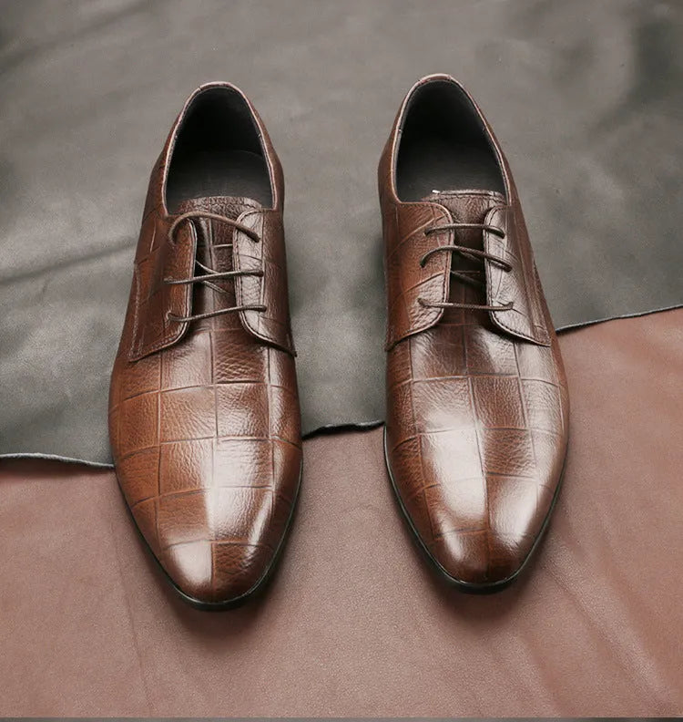 Men's black cow leather Derby shoes with pointed toe and rubber sole on a plain background