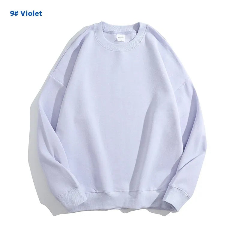 A loose-fitting, off shoulder, round neck cotton sweater in a solid colour with long sleeves.