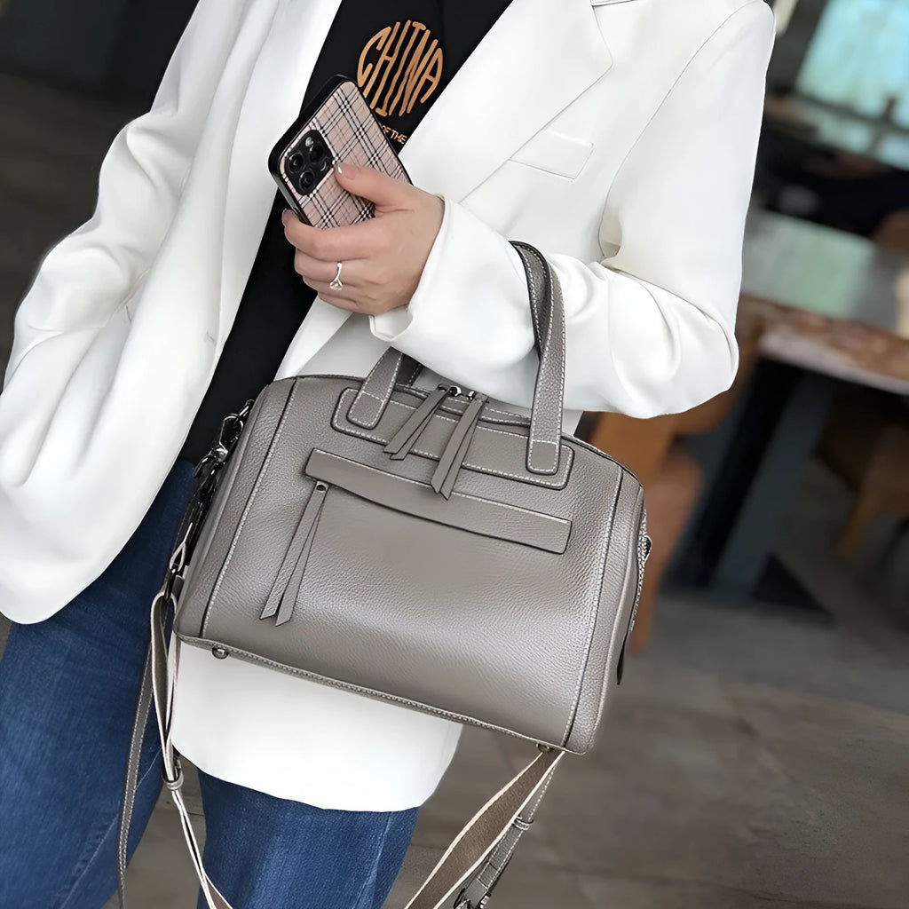 Genuine cowhide leather men's messenger bag in horizontal square shape with lychee pattern.
