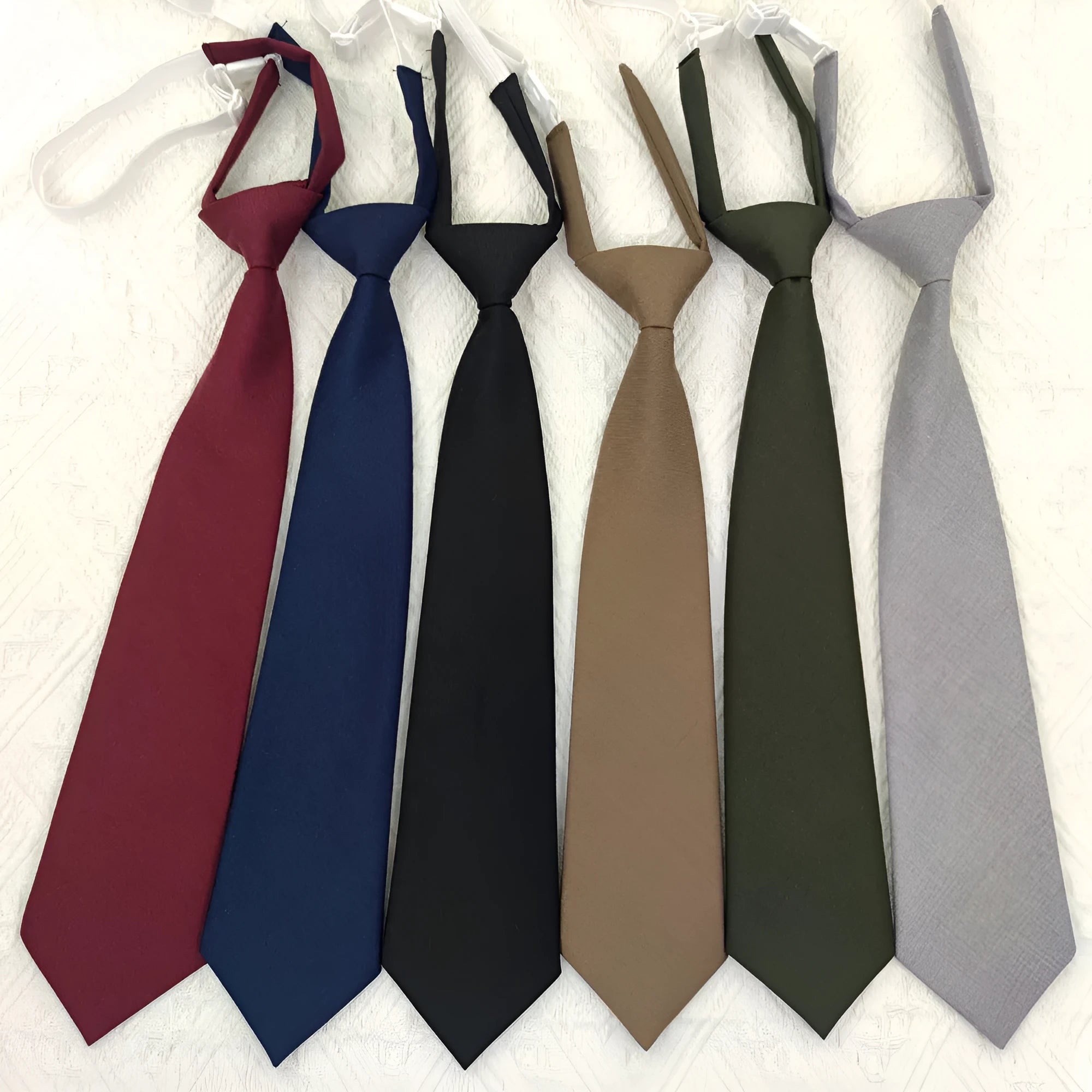 Men's solid colour cotton bow tie in arrow style, showing navy blue colour option.