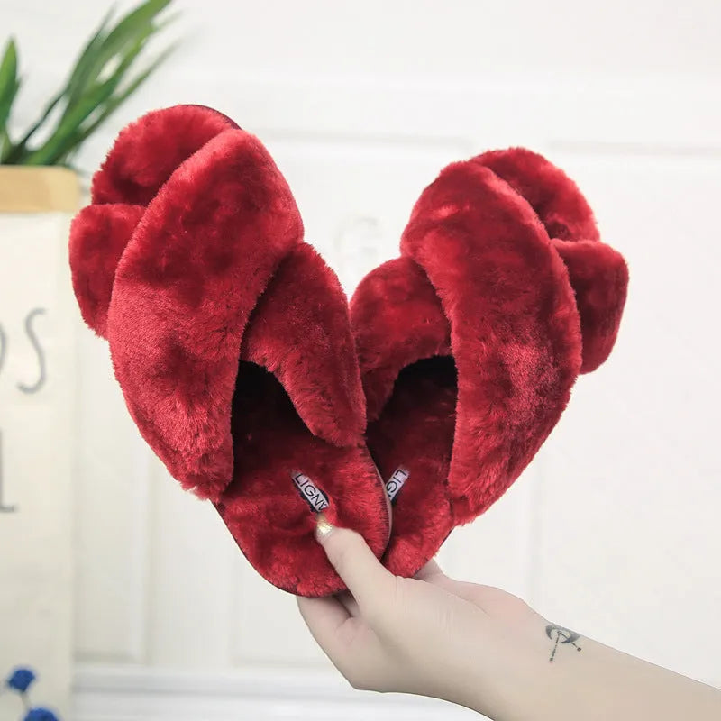 Women's cross open-toe fur slippers in black showing non-slip sole pattern