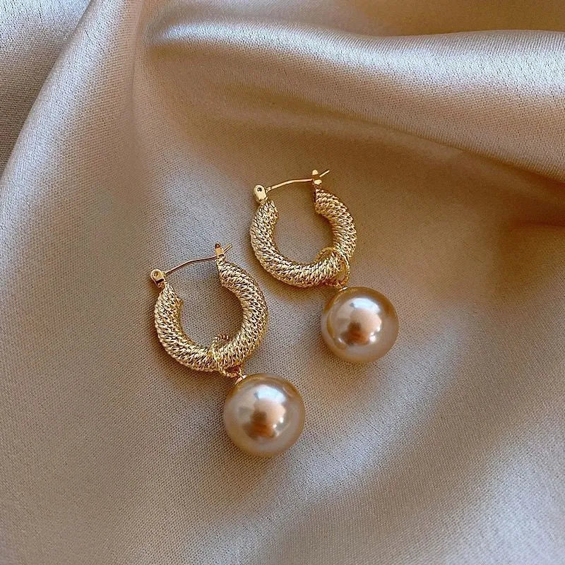 Geometric rose detail zircon earrings for women in copper, available in multiple colours.