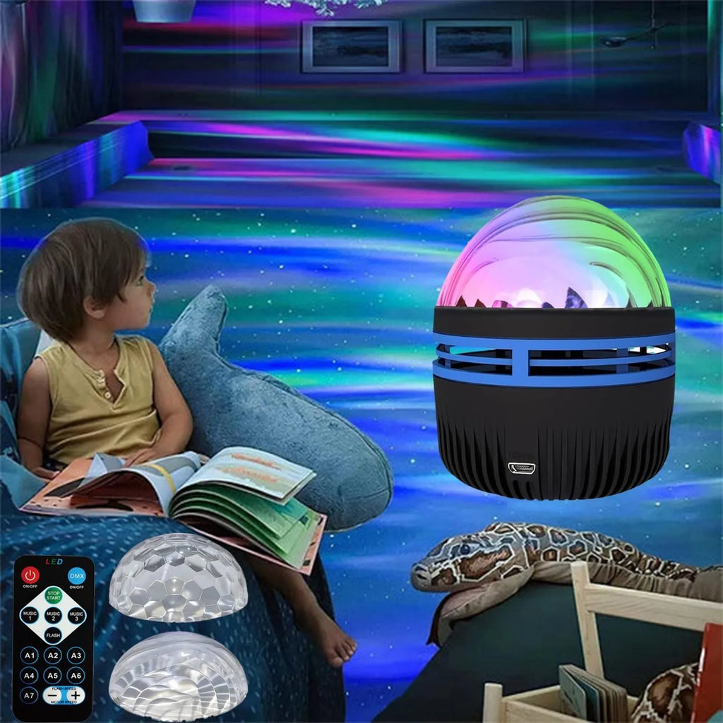 Compact USB-powered LED lamp projecting rotating colourful stars and galaxies onto a dark wall.
