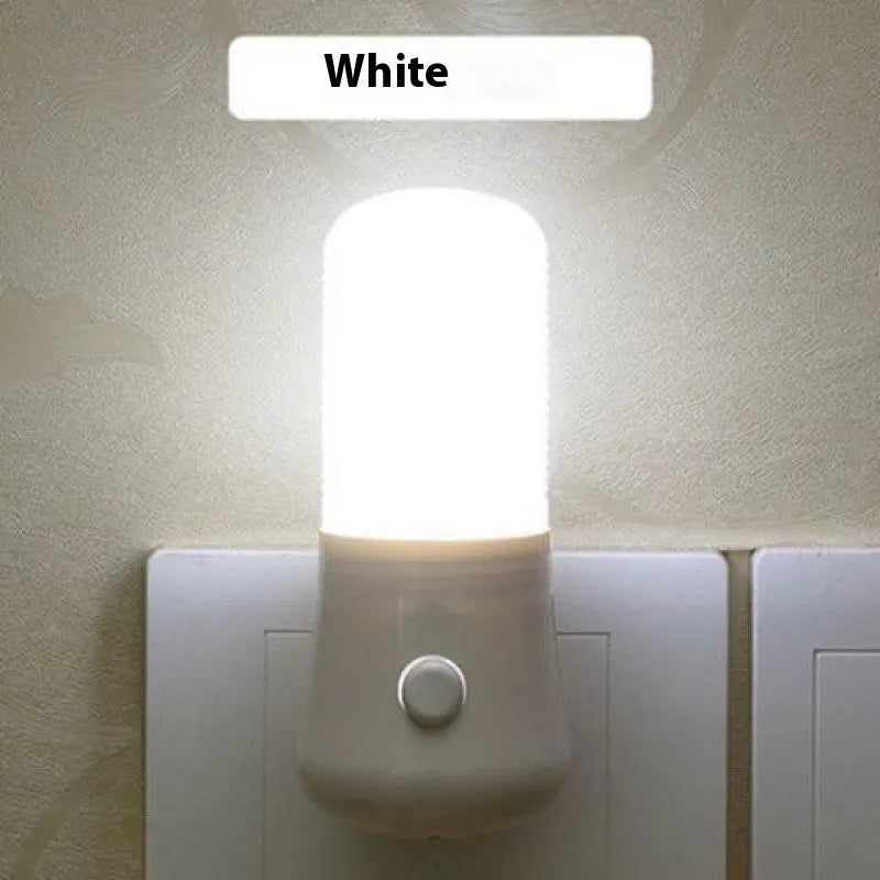 Minimalist plug-in bedside night light with dual colour switch showing white and warm light options