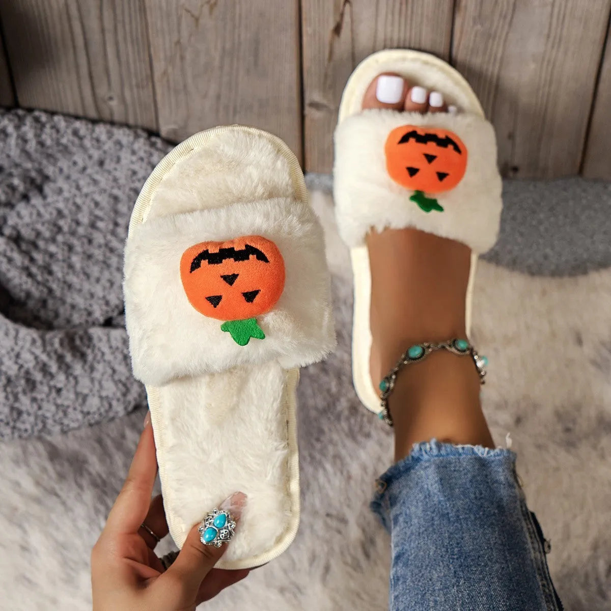 Women's Halloween pumpkin plush slippers in white and yellow with synthetic fur upper