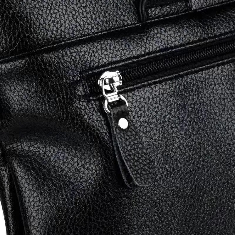 Men's black PU leather business messenger bag with crossbody shoulder strap showing splicing design