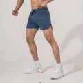 Men's straight-cut polyester fitness shorts in black, available in sizes M to 3XL for sports and casual wear