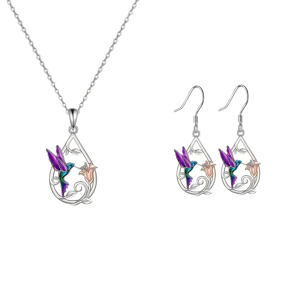 White electroplated copper hummingbird necklace and earring set with animal motifs on a neutral background