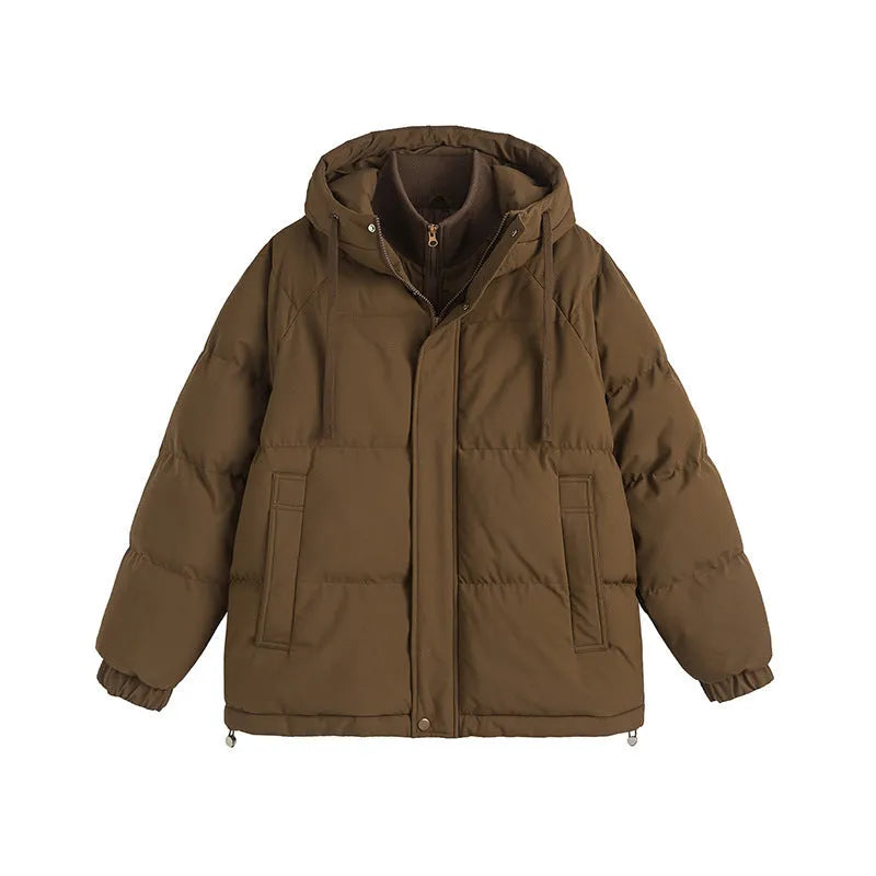 Loose beige cotton-padded jacket with side seam pockets on a hanger