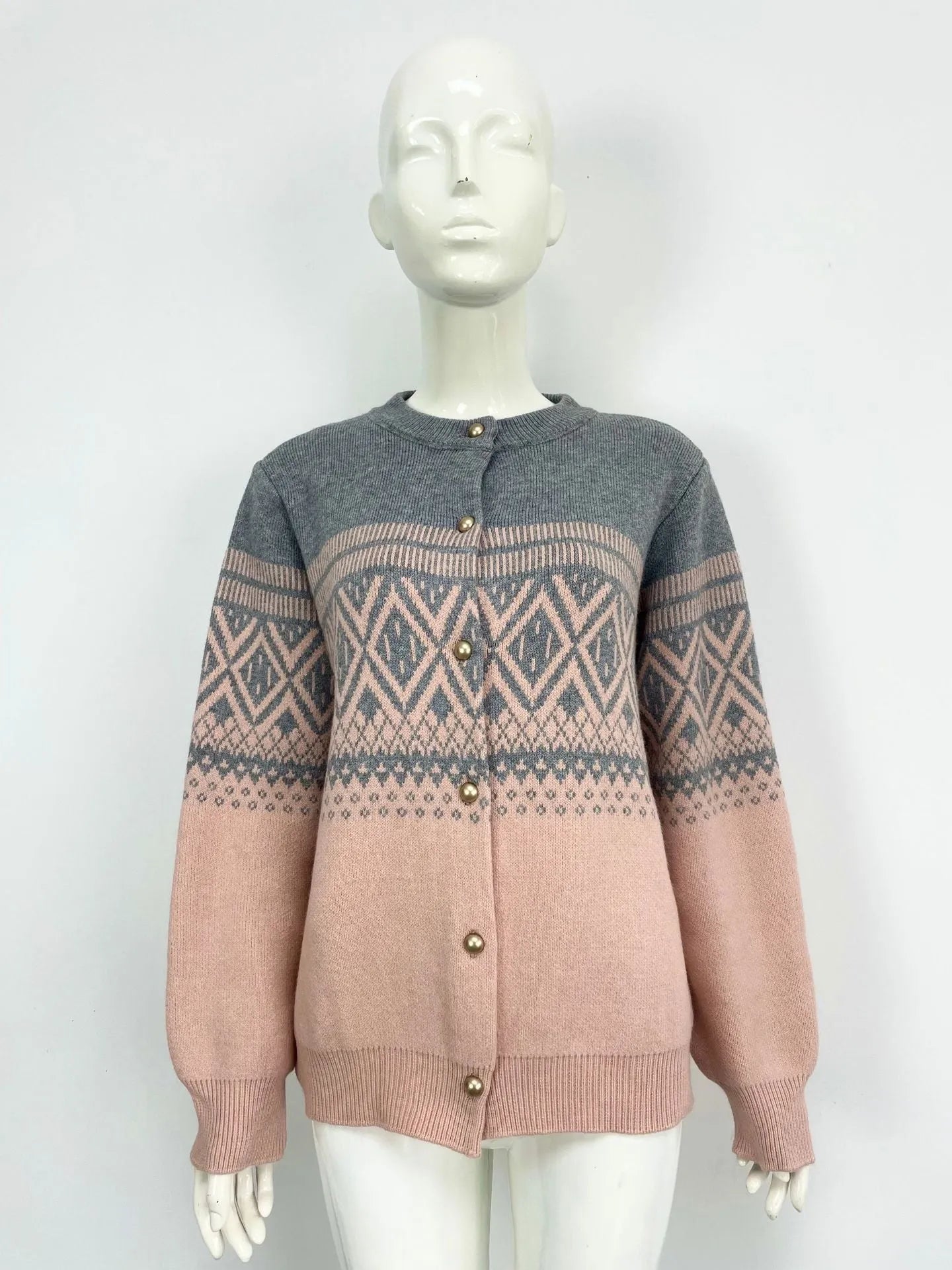 Red women's alpaca wool cardigan with grey diamond knit pattern and long sleeves.