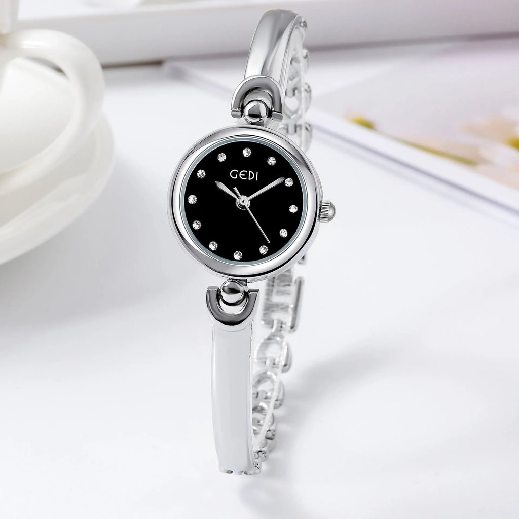 Silver case women's bangle watch with round dial and white plate silver stripe