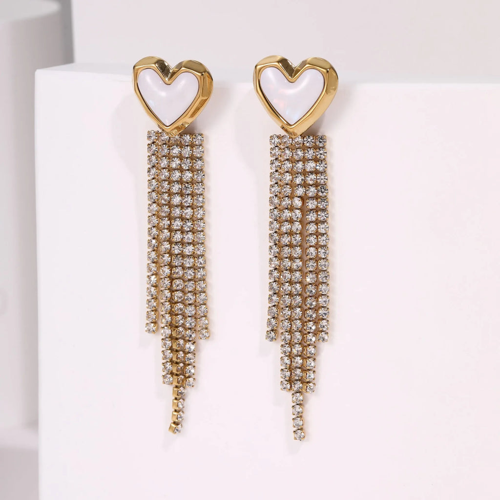 Gold electroplated stainless steel fashion earrings with heart, star, and geometric tassel design.