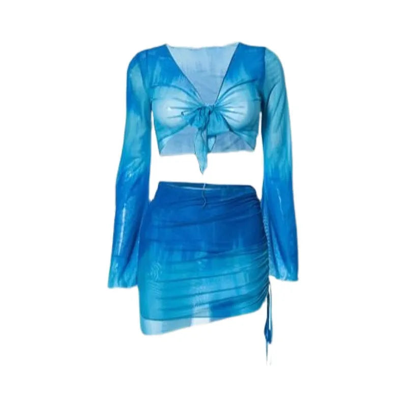 Women's blue four-piece bikini swimsuit set with shirt, bra, underwear, and skirt on hanger