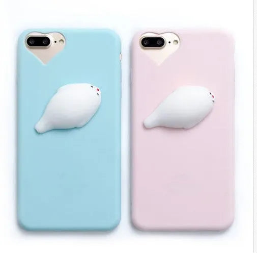 Soft pink TPU iPhone case with a raised white 3D cartoon cat design on the back.
