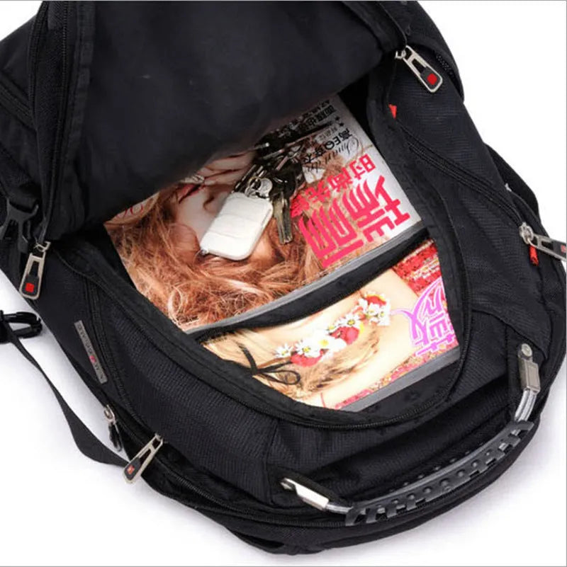 Black business computer backpack open to show three internal compartments and laptop sleeve.