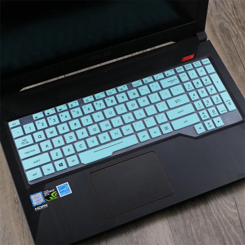 ASUS Flight laptop keyboard protective film cover shown in gradient blue on a laptop