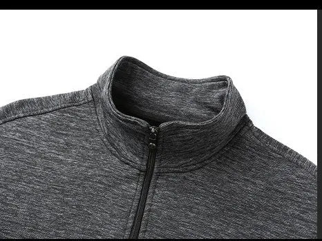 Men's black stand-up collar zip-front jacket in an athletic fit on a hanger.