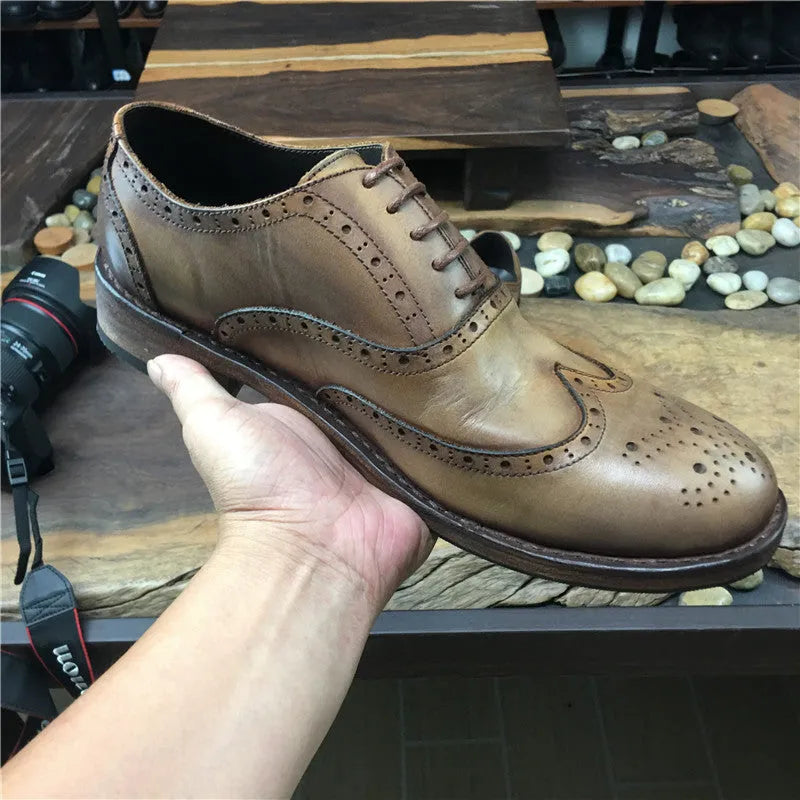 Light brown men's vintage engraved leather casual shoes with distressed finish and lace-up closure.