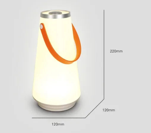 White rechargeable LED bedside night light with adjustable warm glow on wooden table