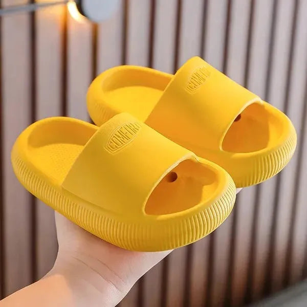 Children's brightly coloured EVA slippers with a thick, non-slip sole.