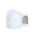 Large white fully enclosed cat litter box with a hood, shown next to a cat for scale.