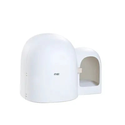 Large white fully enclosed cat litter box with a hood, shown next to a cat for scale.