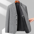 Men's loose fit woolen coat in a solid colour, shown on a model for casual spring or autumn wear.