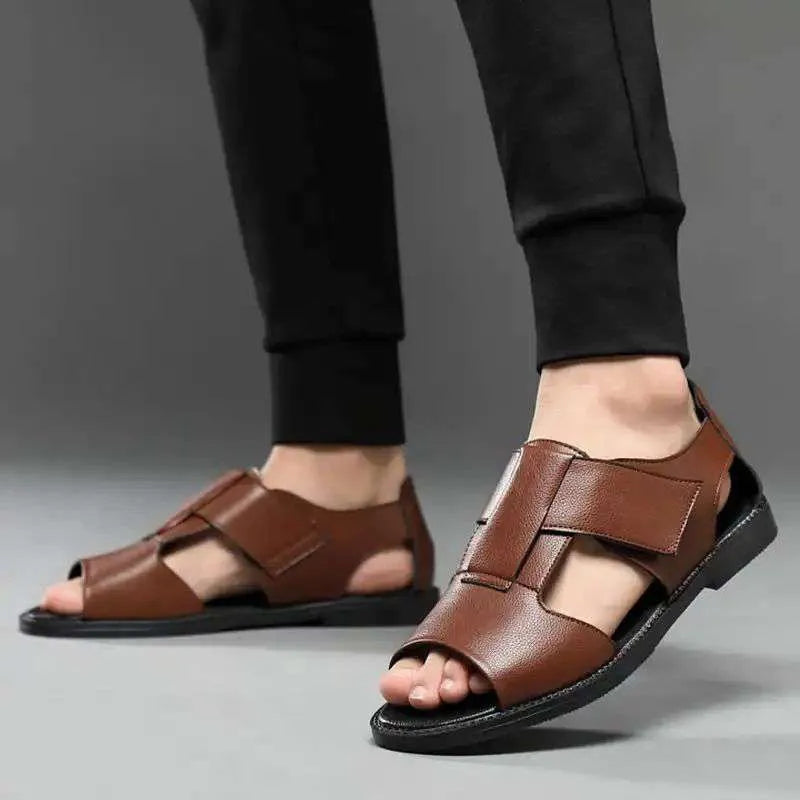 Men's black leather casual sandals with open toe and rubber sole on a plain background.