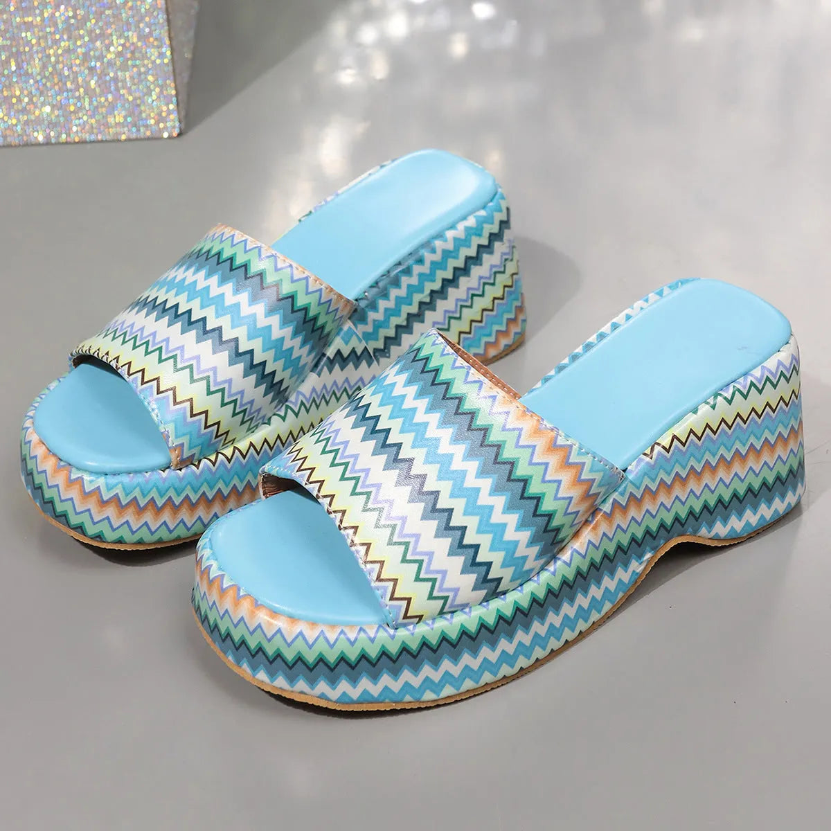 Women's beige wedge sandals with colourful wave print, thick rubber sole, and fish mouth open toe