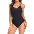 Black backless one-piece swimsuit with mesh panels for women, shown on a mannequin.