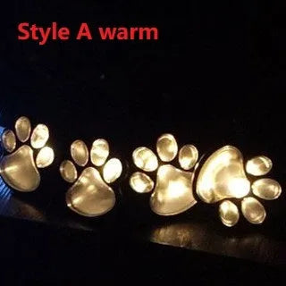 Black bear paw-shaped solar garden lights with solar panel pole for outdoor pathway illumination